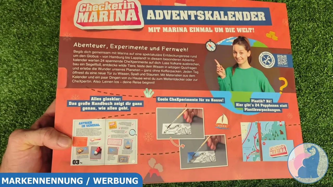 Auf der Rückseite sind Einblicke in das beiliegende 56-seitige Handbuch und die 24 Pappboxen dargestellt.