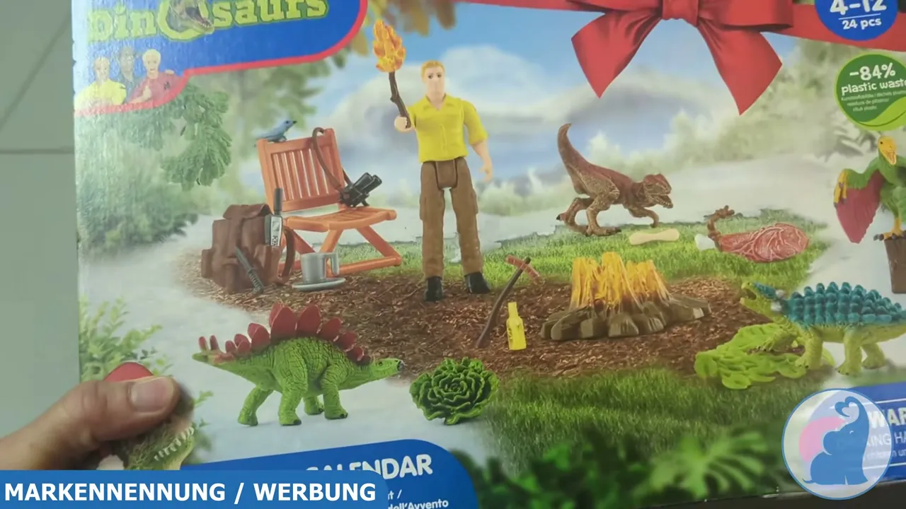Auf der Vorderseite sind die enthaltenen Figuren wie Forscher Luis, kleine Dinos und Zubehör wie das Lagerfeuer abgebildet.