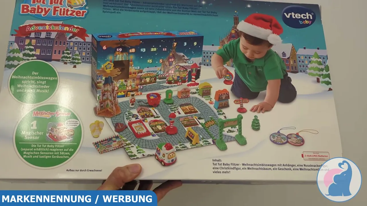 Die Verpackungsrückseite zeigt den gesamten Inhalt samt Weihnachtsimbisswagen, Anhänger und diversen Weihnachtsfiguren.